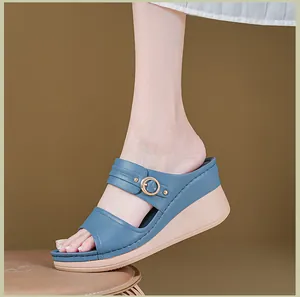 Side view of comfortable women's blue wedge sandals with stylish buckle strap detail