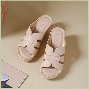 Elegant beige wedge sandals for women with woven strap design and comfortable platform.