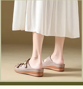 Detailed side view of beige wedge sandals for women with buckle and thick platform