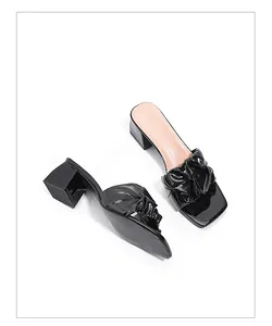 Elegant black patent leather mules with ruffle strap and square toe for women