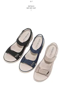 Macro view of women's sports sandals in black, navy, and beige with adjustable Velcro straps