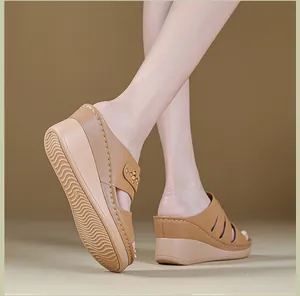 Detailed side view of women's wedge sandals with decorative stitching and thick sole