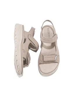 Close-up of beige women's sport sandals with adjustable velcro straps and thick soles
