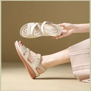 Elegant beige wedge sandals for women featuring adjustable velcro straps for summer wear