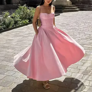 Elegante vestido midi rosa de estilo vintage francés con bolsillos y falda amplia