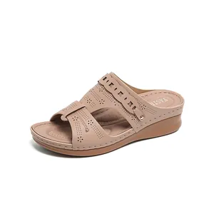 Casual women's beige wedge sandals with decorative laser-cut hollow patterns and gold studs