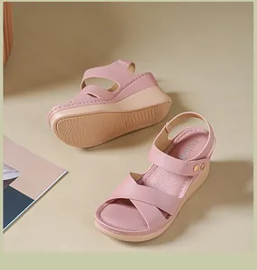 Close-up of stylish pink wedge sandals for women featuring YASIRUN branding on the insole