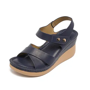 Women's comfortable navy blue platform sandals with crisscross straps and gold buckles