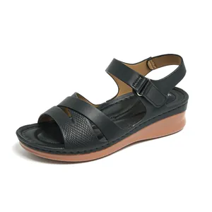 Casual women's black wedge sandals with textured straps and hook and loop closure