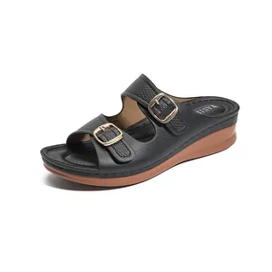 Black wedge peep-toe sandals for women with decorative gold buckles and thick sole