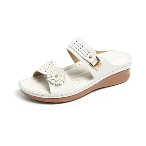 Fashionable white wedge sandals for women featuring flower ornament and laser-cut patterns