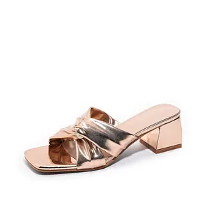 Elegant rose gold metallic high heel sandals with knotted strap and square toe