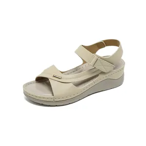 Elegant beige wedge sandals for women featuring hook-and-loop strap and gold detail.
