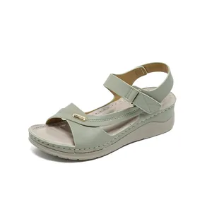 Comfortable light green wedge sandals for women featuring elegant stitched details