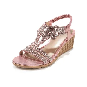 Pink bohemian wedge sandals decorated with sparkling pink rhinestones and elastic strap