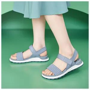 Close-up view of blue fly-woven breathable sports sandals for women with comfortable soles