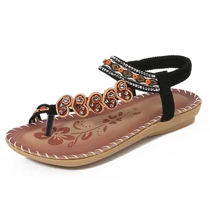 Bohemian flat sandals for women featuring rhinestone hearts and embroidered straps