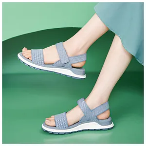 Side view of blue breathable flying woven sandals with lightweight soft TPR soles