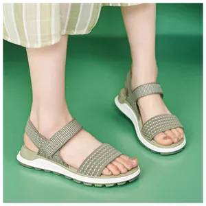 Close-up of women's green fly-woven sporty sandals with breathable soft TPR soles