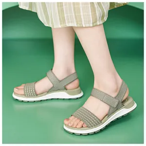 Detail view of women's green knitted sporty sandals featuring soft and comfortable TPR soles