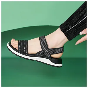 Detailed view of women's black flying woven sports sandal with breathable soft sole
