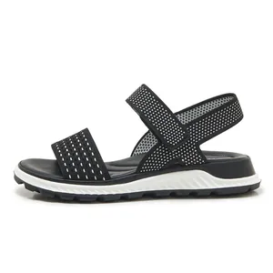 Detail view of black fly-knit sports sandal with breathable mesh and thick TPR sole.