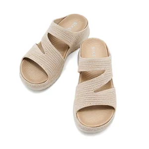 Top-down view of stylish beige sporty wedge sandals featuring breathable knit hollow straps
