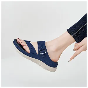 Close-up of navy blue mesh platform sandal with adjustable strap and thick sole