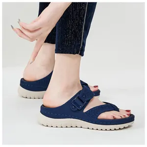 Close-up of navy blue platform sports sandals with mesh hollow design and thick sole