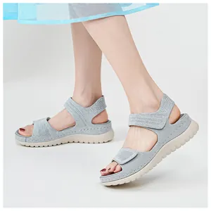 Close-up of grey platform sports sandals with mesh fabric and adjustable velcro straps