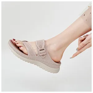 Close-up detail of women's breathable beige knit sandals with thick sole on foot