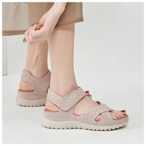 Detail view of pink mesh platform sandals with adjustable hook-and-loop straps