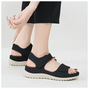 Close-up of black women's sports casual sandals with mesh upper and Velcro straps