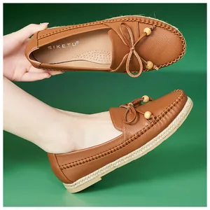 Comfortable brown leather loafers for women with decorative bow and wooden beads detail