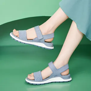 Breathable fly-knit women's sports sandals with soft TPR sole and blue finish.