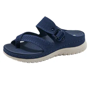 Detail of navy blue knitted platform sandal with side buckle and comfortable textured sole.