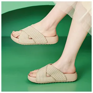 Detailed view of beige platform slides with criss-cross knit straps for summer.