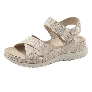 Side profile of beige sporty wedge sandals for women featuring knitted cross straps
