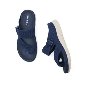 Close-up view of navy blue knitted platform sandals with adjustable straps for women