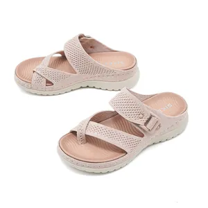 Detailed view of pink mesh platform sandals with adjustable straps for women