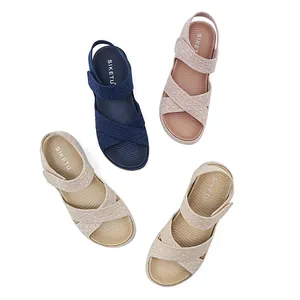 Overhead view of women's casual sandals with velcro straps and hollow textured thick soles