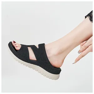 Close-up of black knit wedge sandals for women with breathable hollow out design