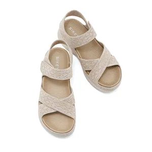 Comfortable beige woven platform sandals with adjustable Velcro strap and hollow design