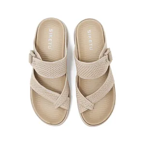 Detailed view of beige woven platform sandals with adjustable Velcro strap and SIKETU logo.
