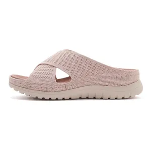 Detailed view of women's breathable pink knit sandals with thick soles and casual style