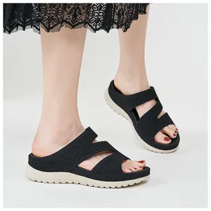 Side view showing details of black hollow-out platform sports sandals for women
