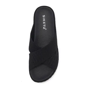 Black women's flyknit criss-cross slide sandal with comfortable contoured footbed