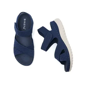 Detail view of navy blue women's platform sport sandals with breathable knit upper
