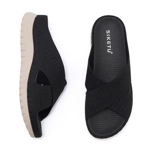 Overhead and side views of black fly-knit crossover platform slide sandals for women