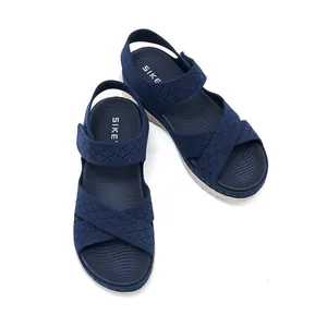 Navy blue sports sandals with hollow knit straps, Velcro closure and platform sole
